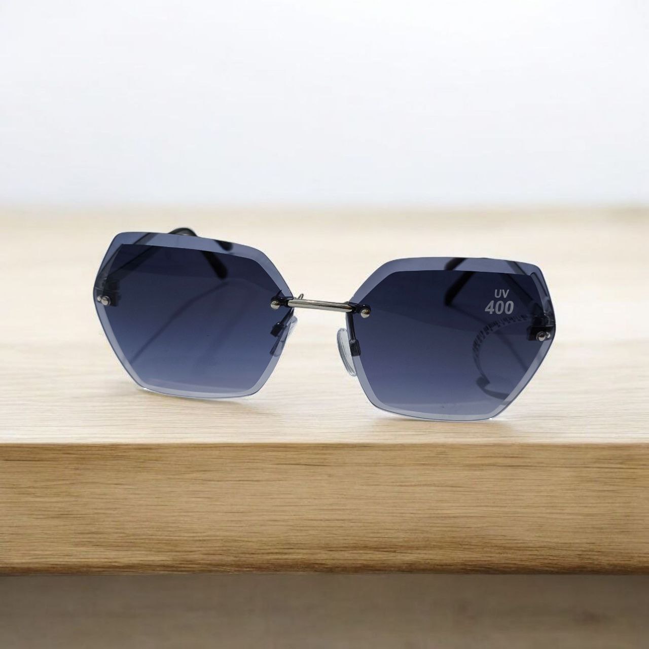 hexagon rimless sunglasses dodi eyenake عینک افتابی زنانه فریم نامرئی شش ضلعی با عدسی دودی طیف دار از عینکه